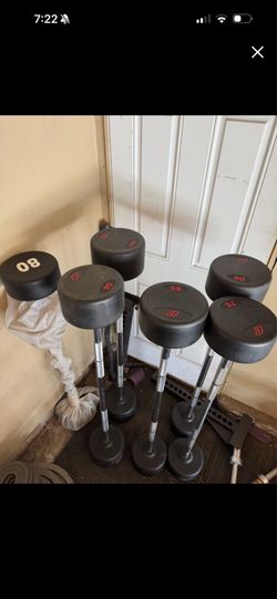 Commercial straight bars 75-100lbs weights 525lbs total