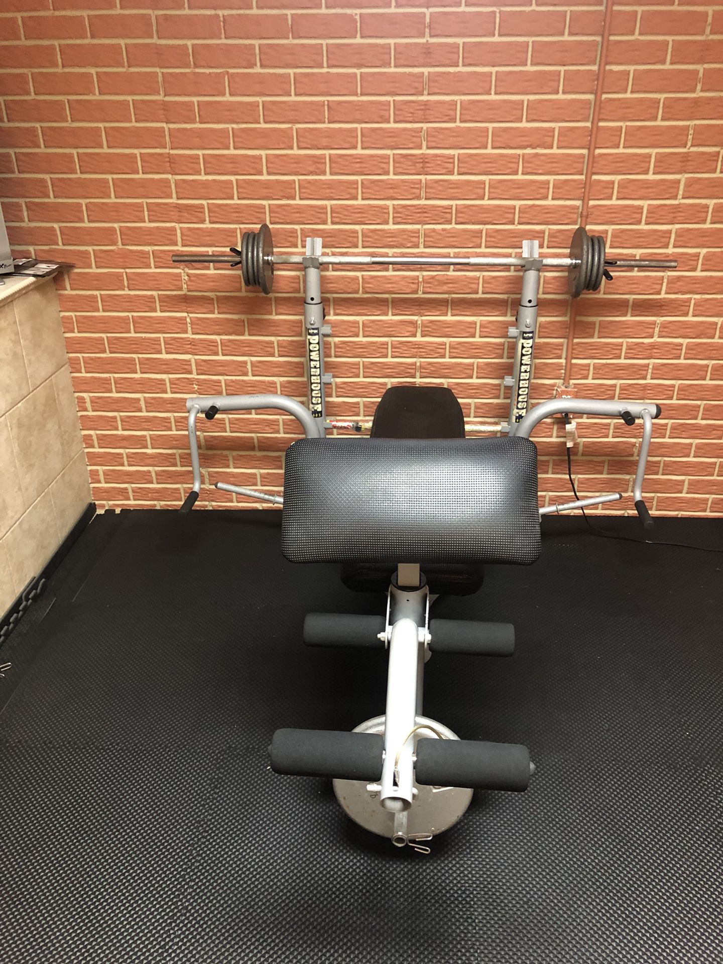 Powerhouse home gym with weights and bars