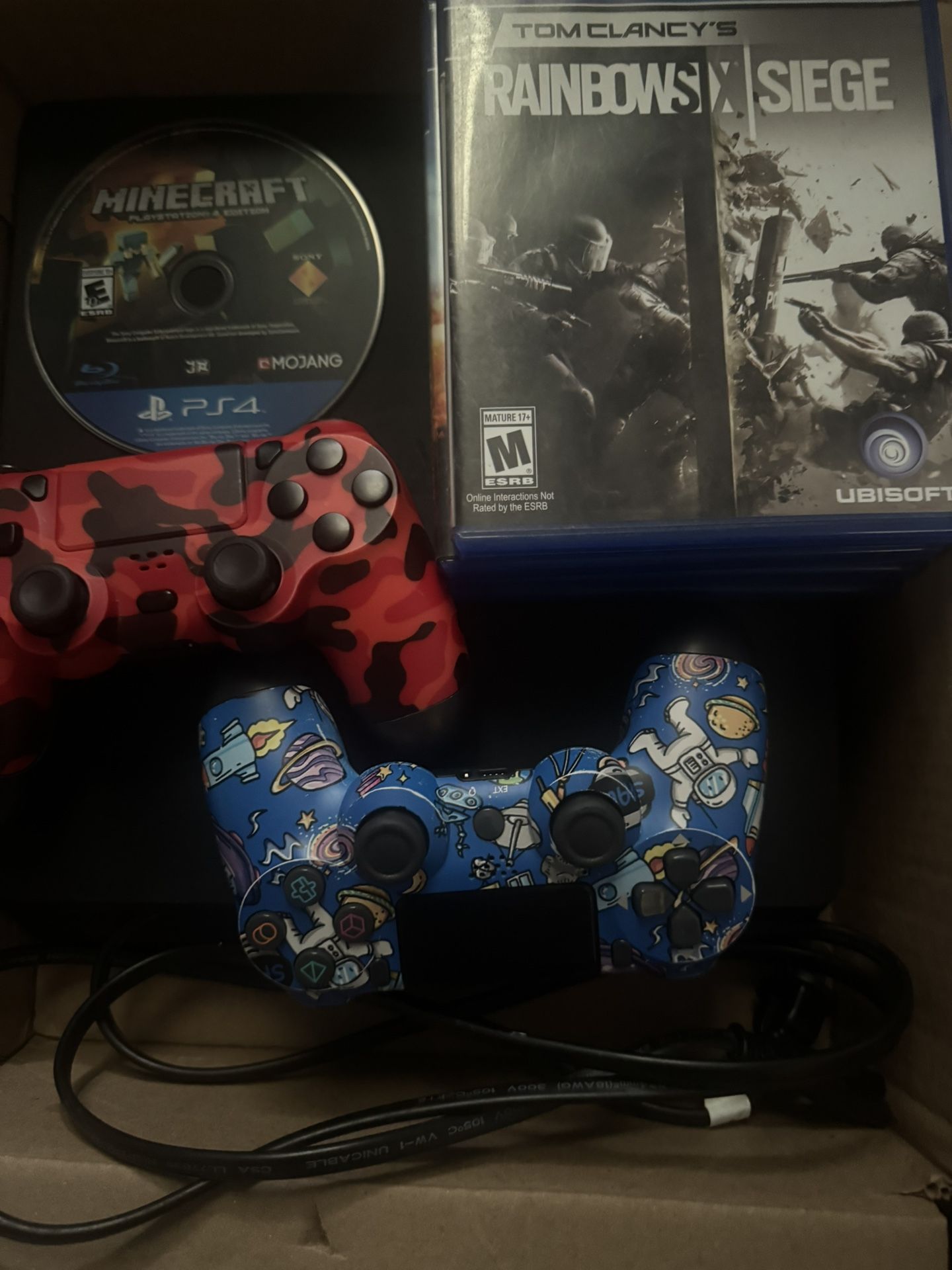 PS4 SLIM with 4 random games, minecraft, 2 controllers, and a power cord.