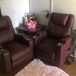 Two reclining chairs stands up Reclines heats vibrates