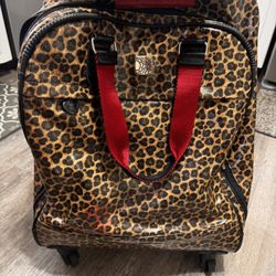  Brighton Catwalk Weekender rolling carry-on Luggage bag with a leopard print. 