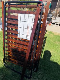 Disassembled Wooden baby crib