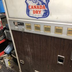 Three vintage soda machines