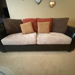 Leather  COuch With Washable Fabric  Seats & Pillows covers.  All Pillows Are Included.  ( Couch & Loveseat COMBO)  