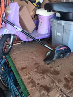 Lawn edger attachment fits most machines with round shaft. 23 Mile and Card Macomb Township Michigan