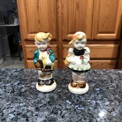 Vintage Young Boy And Girl Occupied Japan Pair of Salt and Pepper Shakers.  Size approximately 4 1/2 inches tall.  Preowned with original cork stopper