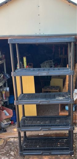 5-Tier Plastic Shelving Unit Solid shelf it’s 71 inches tall 35 wide and 17 inches deep