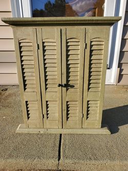 Attractive green painted woodrn shuttered mirror