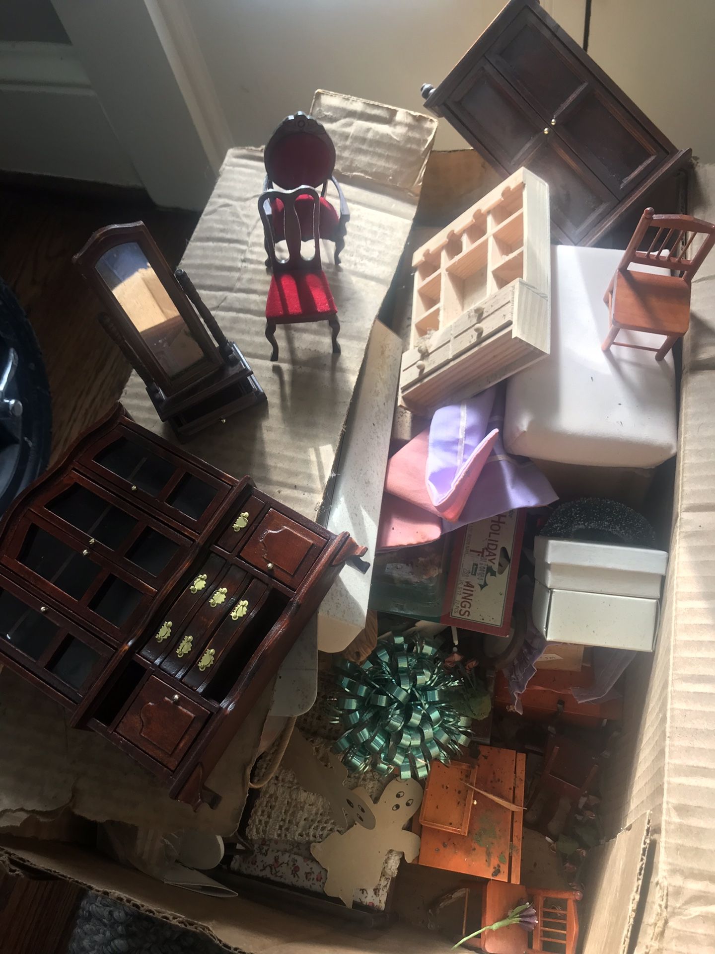 Box of dusty but good doll house furniture and doll house holiday decorations