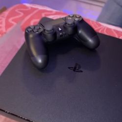 PS4 with controller and cables 