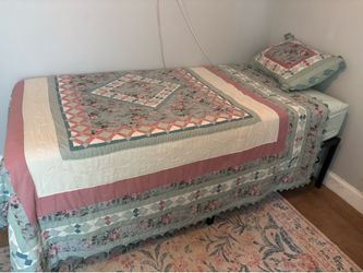 Twin XL cooling mattress and black bed frame