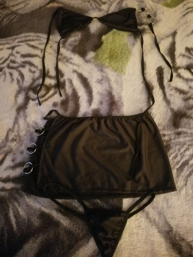 A Woman's Black Nighty with Thongs.
