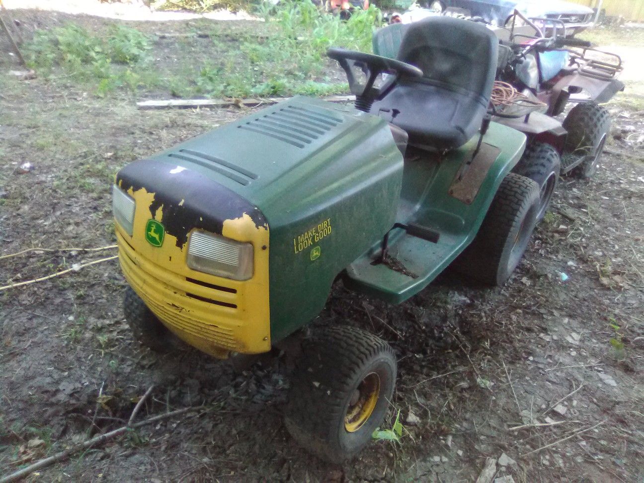 Photo John Deere riding mower starts runs good needs deck has trailer hitch on the rear has v twin engine