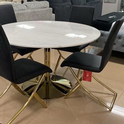 Dining Table Gold And White With 4 Black And Good Chairs 