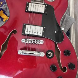 Firefly semi-hollow (ES-335–style) electric guitar in red