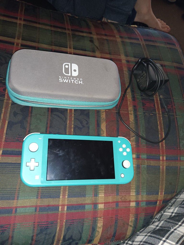 Nintendo switch lite turquoise color with wall charger and carry case