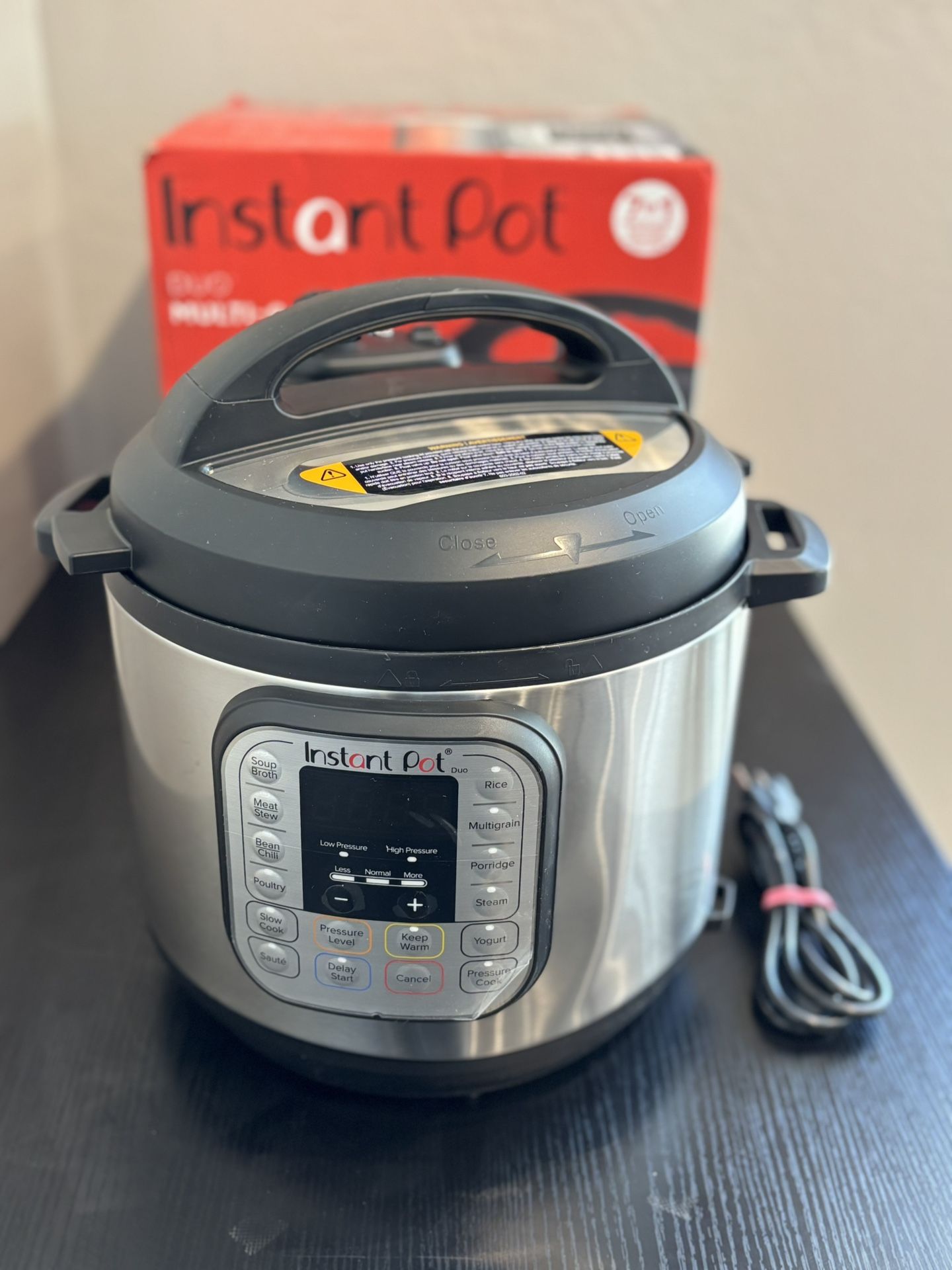 Instant Pot Duo 6 Quart 7-in-1 Programmable Stainless Steel Pressure Cooker Open box item is new has small dent only comes with what is pictured! Th
