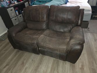 Brown loveseat recliner and glider
