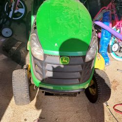 John Deere riding mower for sale or trade for golf cart 