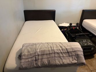 Two  twin  vinyl leather headboards brown
