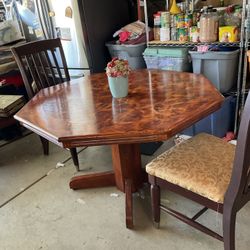 Beautiful wood hexagon kitchen table with two solid wood chairs