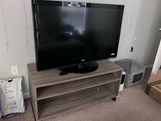 LG Flat Screen TV Black with bookshelf/stand