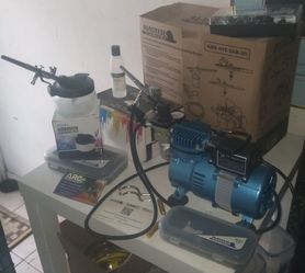 Airbrush kit with 24 paints and cleaning gear