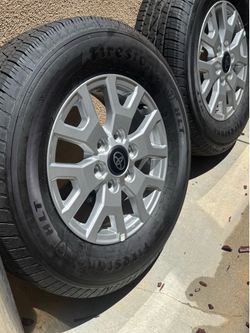 Brand new Toyota factory wheels and Firestone tires