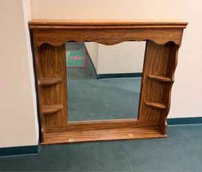 Large mirror with built-in shelving