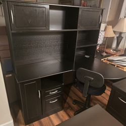 Black corner desk with hutch and office chair and filing cabinet 