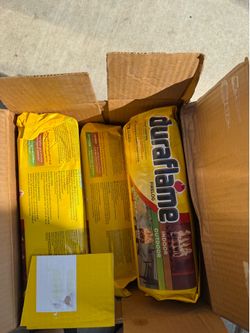 Two boxes of new duraflame logs two sizes 4.5lbs & 6 lbs