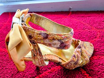 Low-Heel Ankle-Strap Pumps featuring a Statement Back Bow