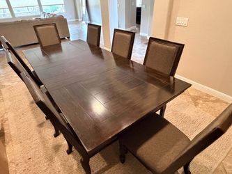 Brown wood Eight chair dining table set with buffet