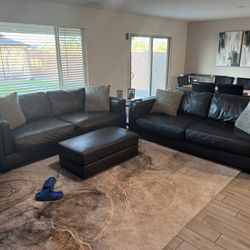 2 Leather Couches with Ottoman by Ashley Furniture