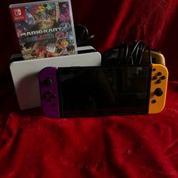 Nintendo Switch with Mario Kart 8 and shoes