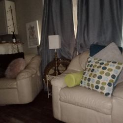 Two Leather Chairs & Footstool