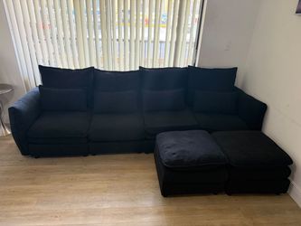 4 seater Black linen sectional/sofa with 2 ottomans