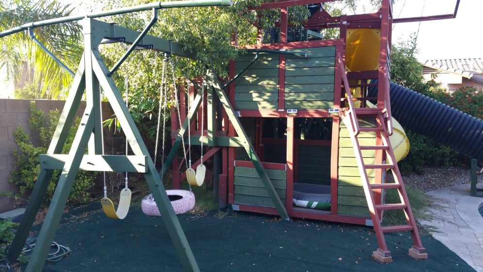 Play house with 3 slides and swing set.