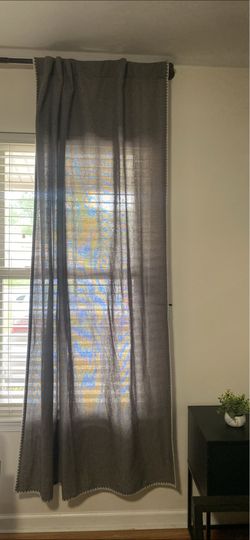 Sheer Grey curtains with white trim