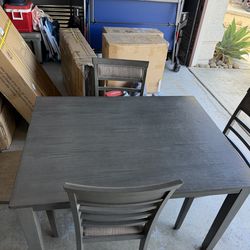 Grey dining table and chairs