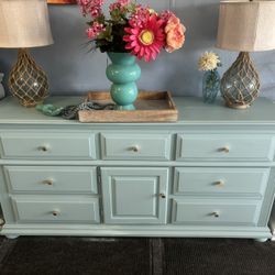 Green Buffet Style Dresser With Decorative Knobs