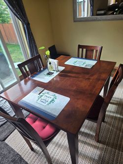Table and 4 chairs plus pads