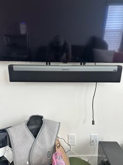 Sonos playbar with tv mount, subwoofer and Sonos one SL’s with stands.