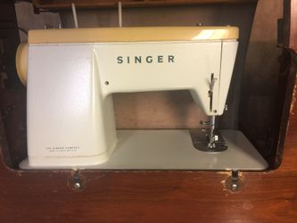 Singer sewing machine with table and ruler in it
