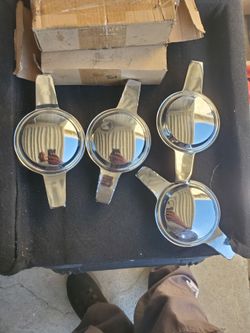 Knockoffs chrome 2 prong gd condition and adapters 5 lugs universal  gd condition