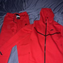 Black and grey Nike Tech, and Red Nike Tech