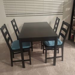 Table, Chairs And Bookcase