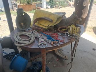 Horse saddle and equipment. Vintage railroad lamp