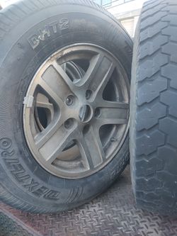 17 " Mag Wheels One Has A Good Tire The Other Needs Repair