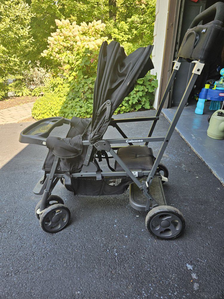 Joovy Caboose Sit and Stand Double Stroller with Rear Bench and Standing Platform